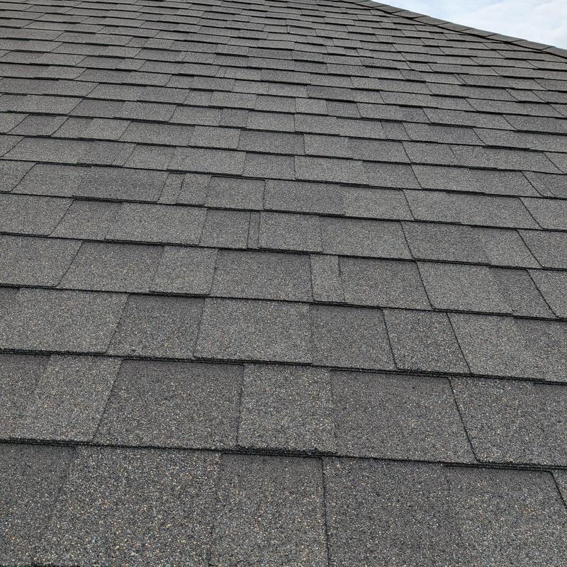 Asphalt shingle roof surface with slight wear