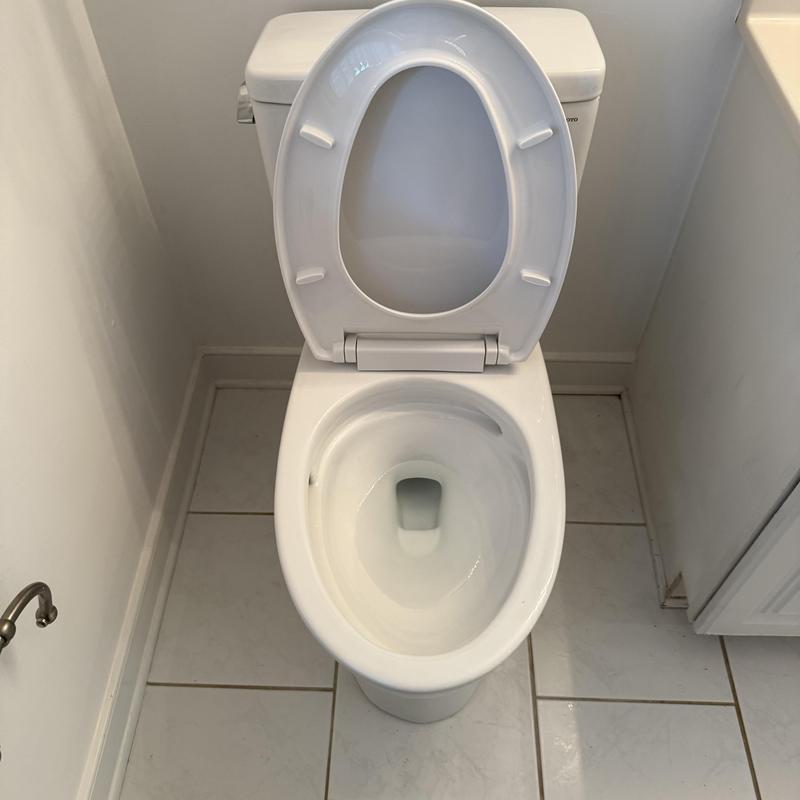 Toto Drake toilet with open seat in bathroom Toto Drake toilet with open seat in bathroom