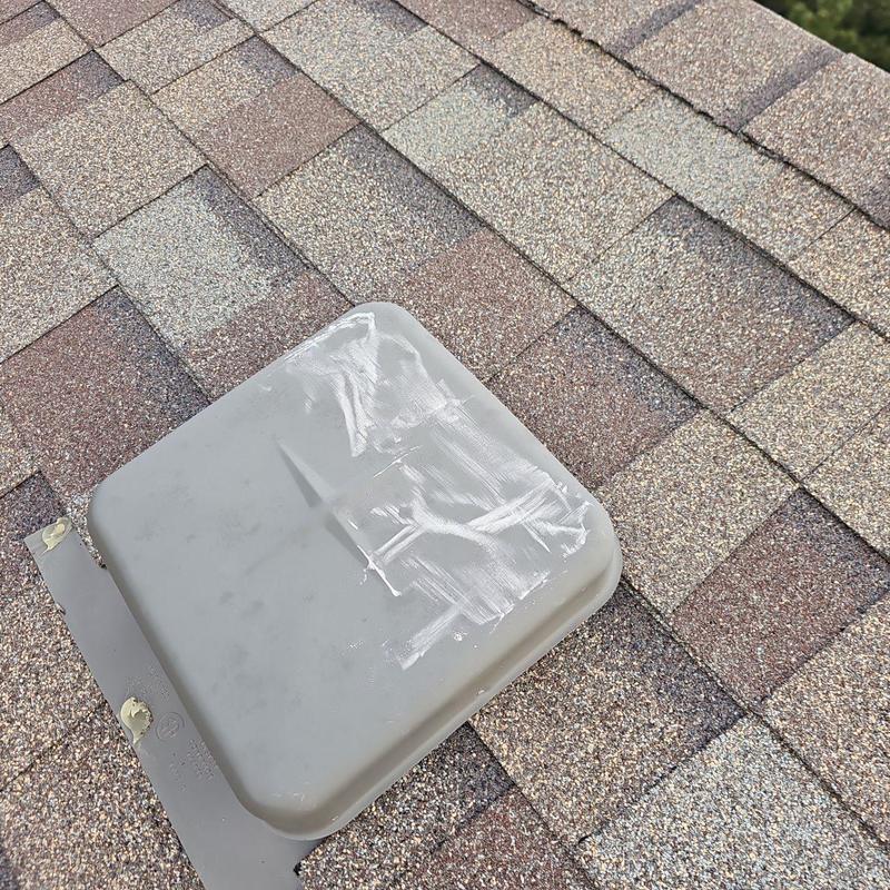 Roof vent with hail damage on shingle roof Roof vent with hail damage on shingle roof