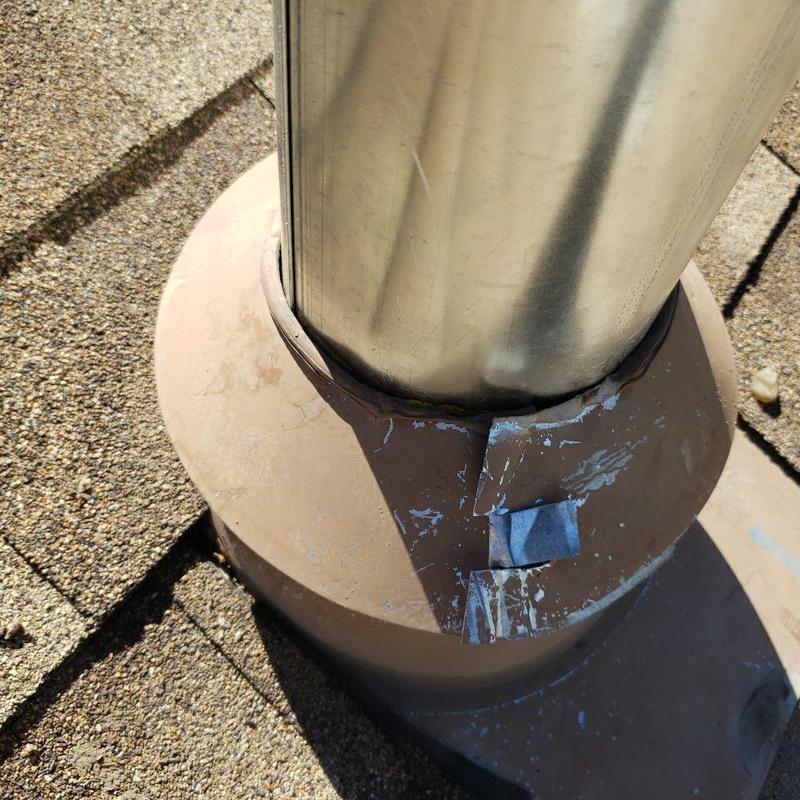 Metal pipe jack flashing on shingle roof with sealant Metal pipe jack flashing on shingle roof with sealant