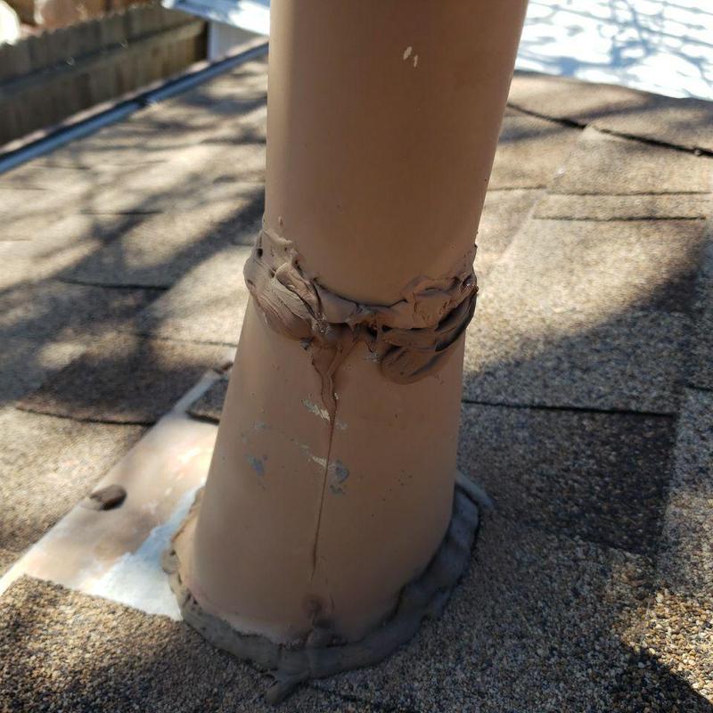 Pipe jack roof flashing with sealant on shingle roof Pipe jack roof flashing with sealant on shingle roof