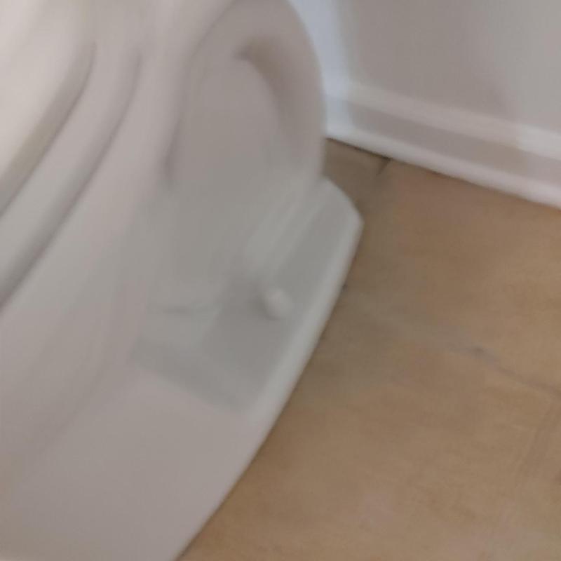 Toilet base seal with floor molding and wall trim Toilet base seal with floor molding and wall trim