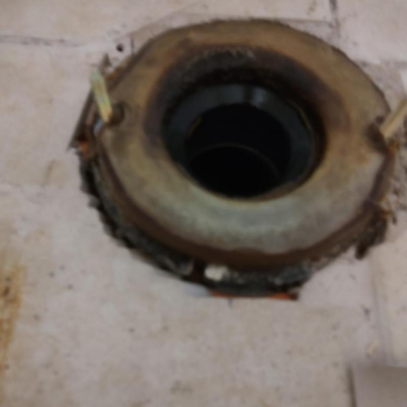 Toilet flange and closet bolts on tile floor Toilet flange and closet bolts on tile floor
