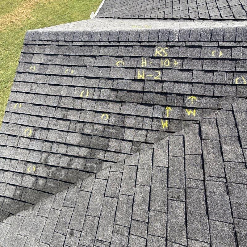Roof shingles with hail damage markings