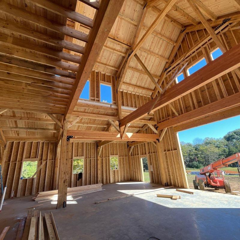 Wooden roof framing with exposed beams and trusses