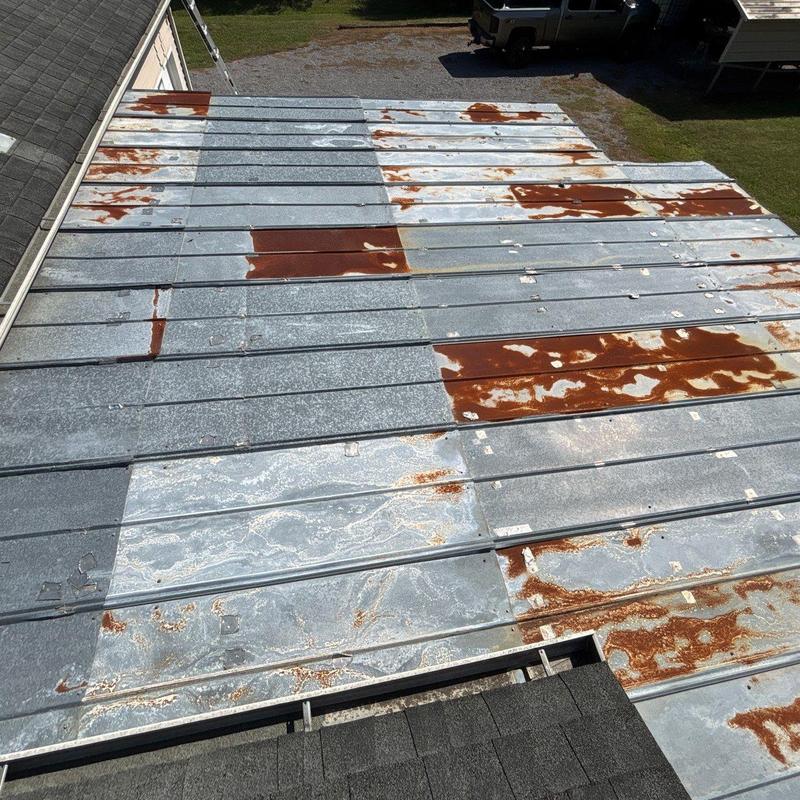 Metal roof panels with extensive rust and corrosion