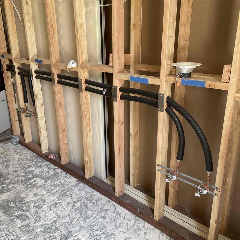 PEX-A domestic hot and cold water piping installation in wall framing