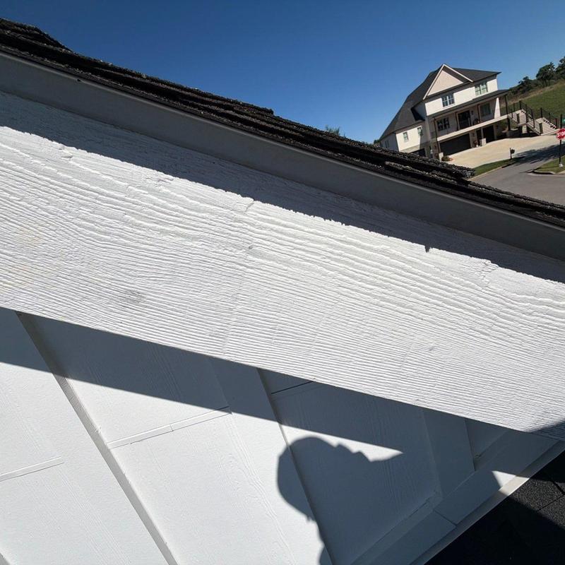 Asphalt shingle roof edge inspection with shadow