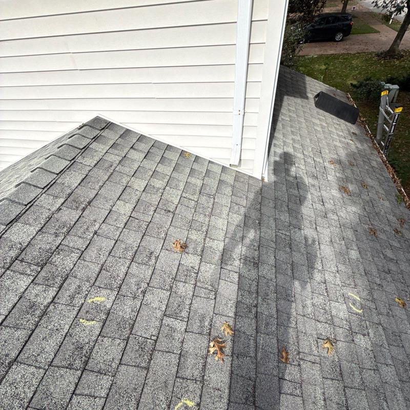 Asphalt shingle roof with hail damage inspection marks