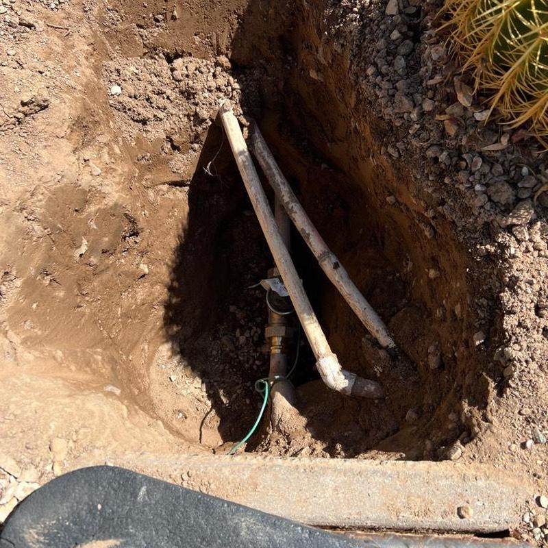 Water main valve and pressure regulator installation in trench