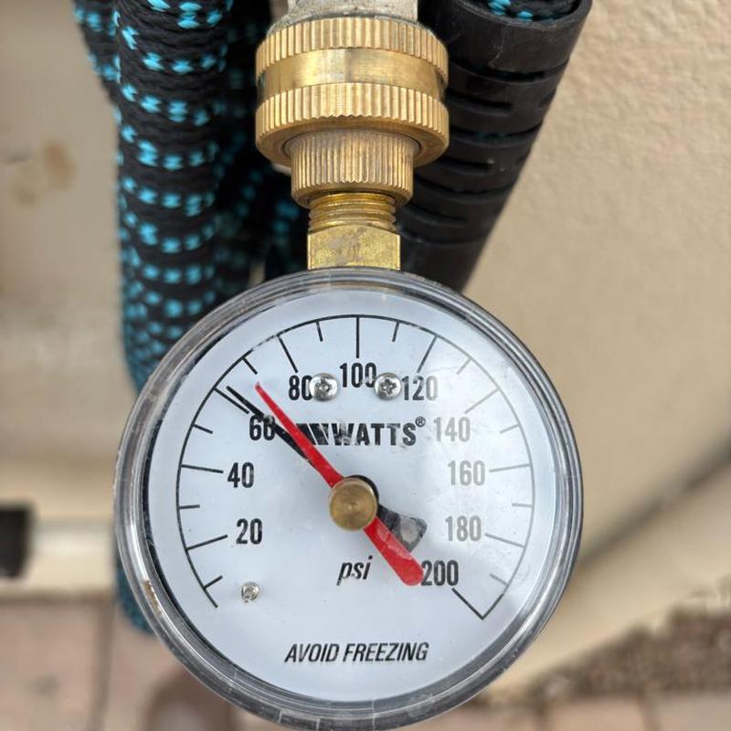 Pressure relief valve pressure gauge showing 65 psi reading