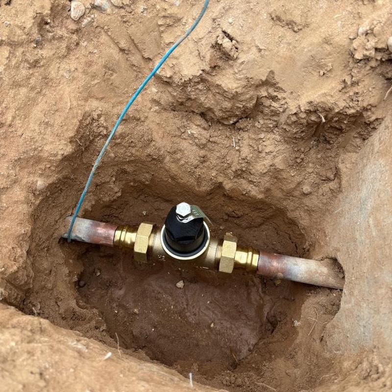 Pressure reducing valve on copper water main underground