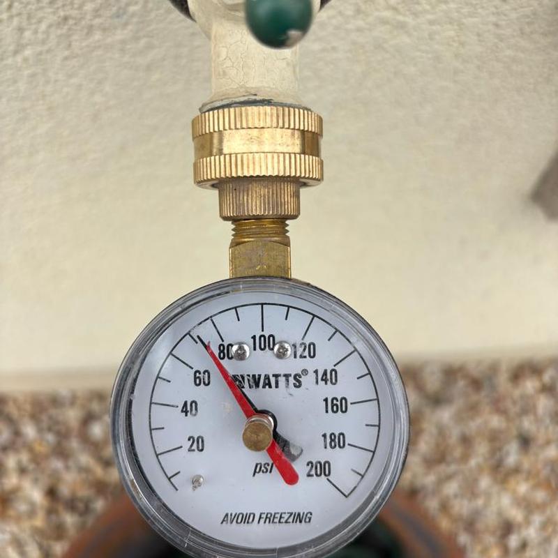 Water pressure gauge on home water main at 80 psi