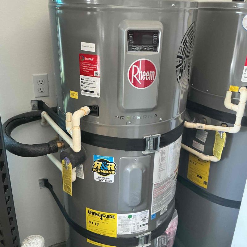 Rheem water heater with pipes and control panel