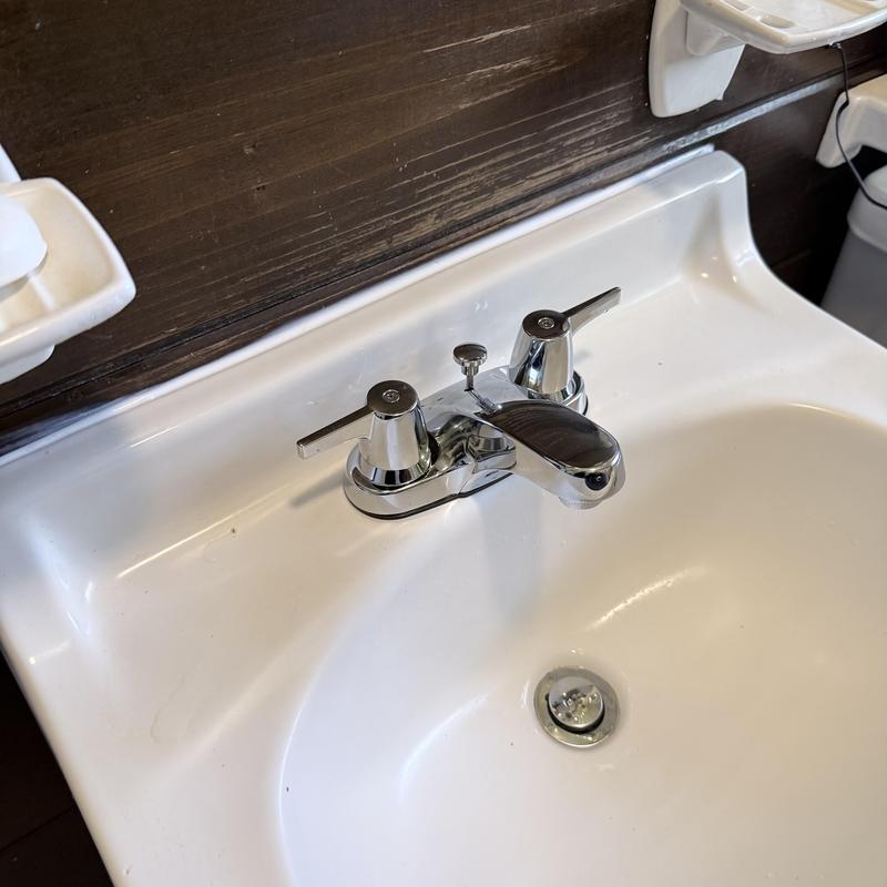 Bathroom sink faucet with chrome handles and stopper Bathroom sink faucet with chrome handles and stopper