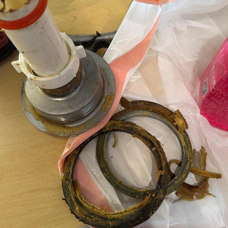 Kitchen sink basket strainer with old rubber gaskets removed