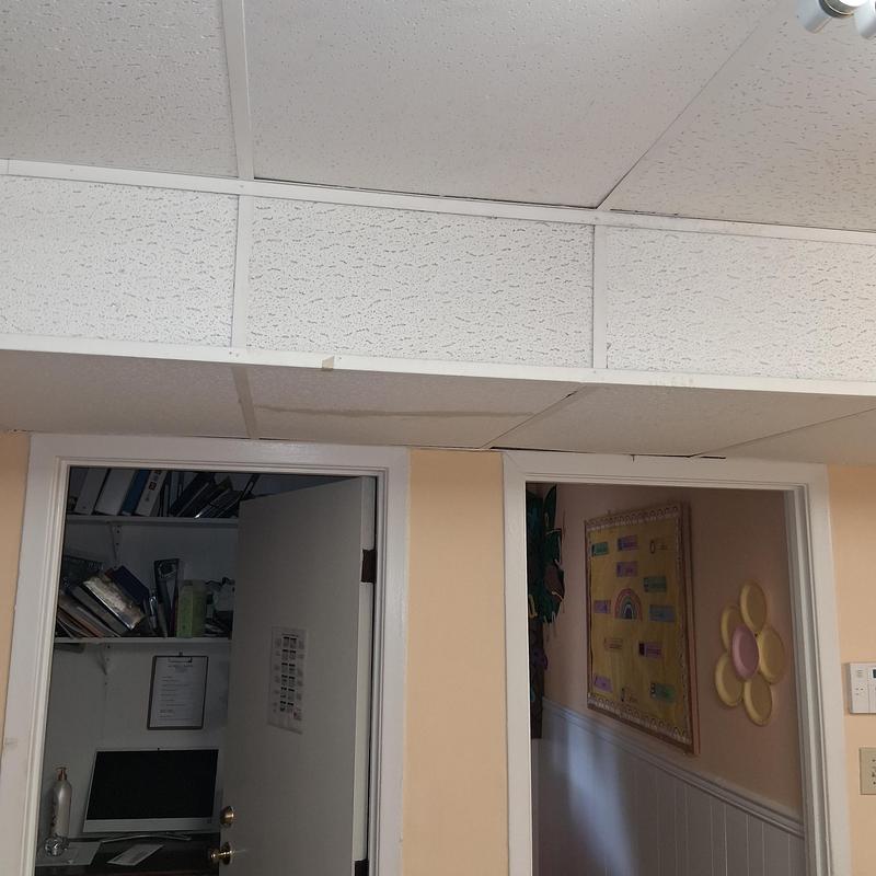 Ceiling tiles replacement above doorways in hallway