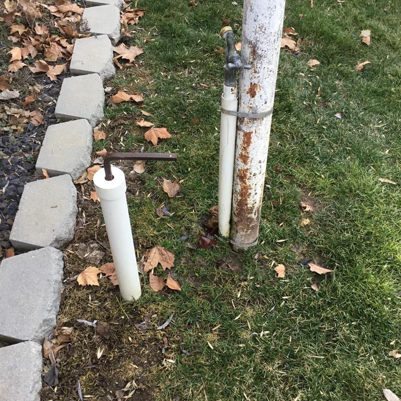 Leaking outdoor spigot and PVC water riser in yard