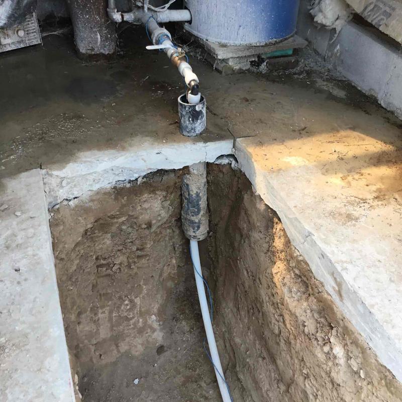Underground pipe boring and vault installation in basement