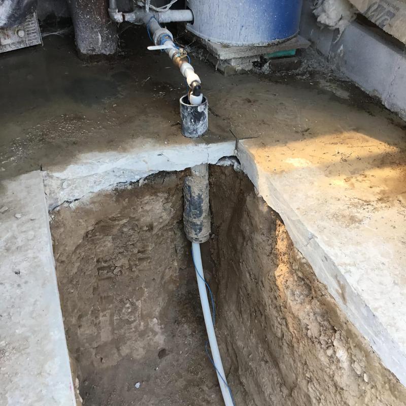 Water pipe excavation and repair in basement floor