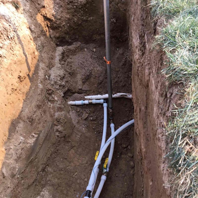 Poly pipe underground boring with valves in trench