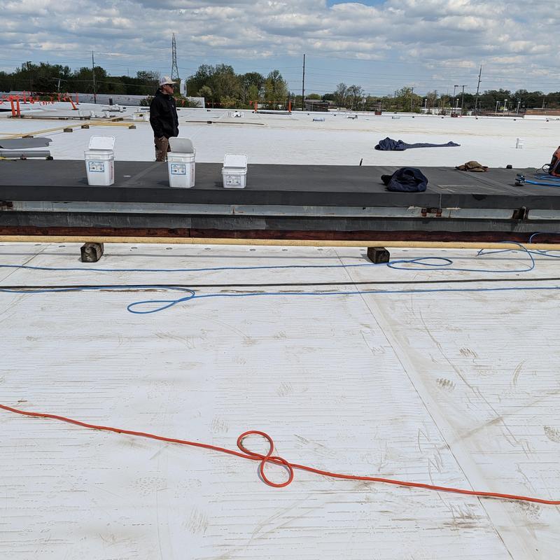 TPO single ply roof restoration with loose rock removed