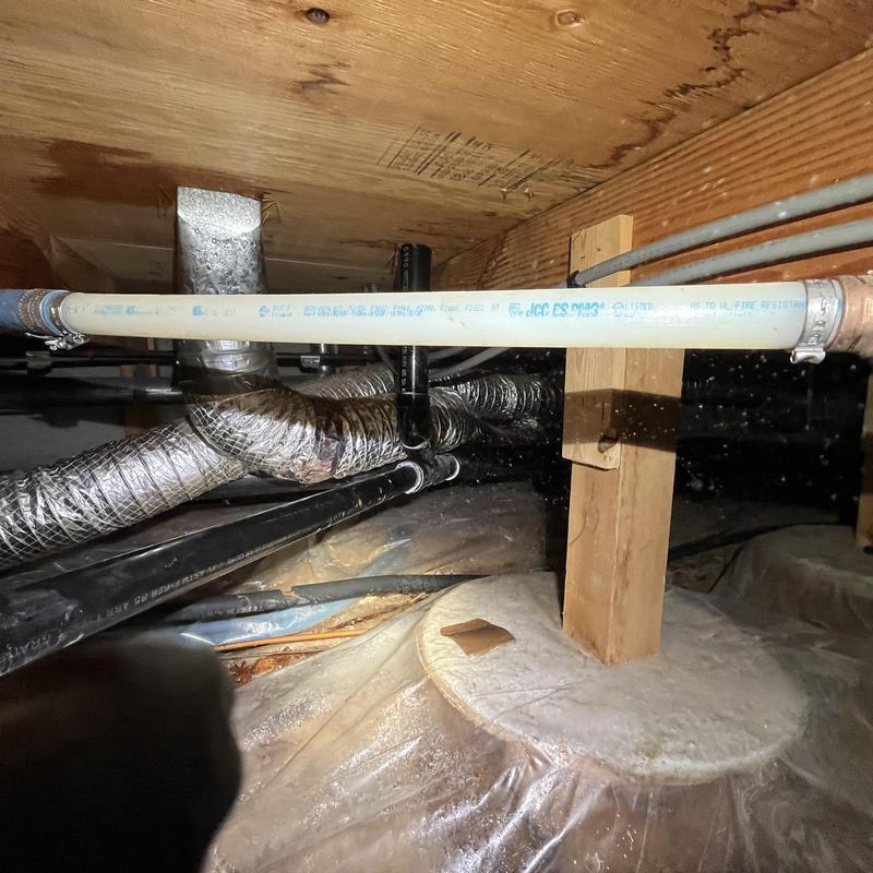 Polybutylene pipe in crawlspace with support post