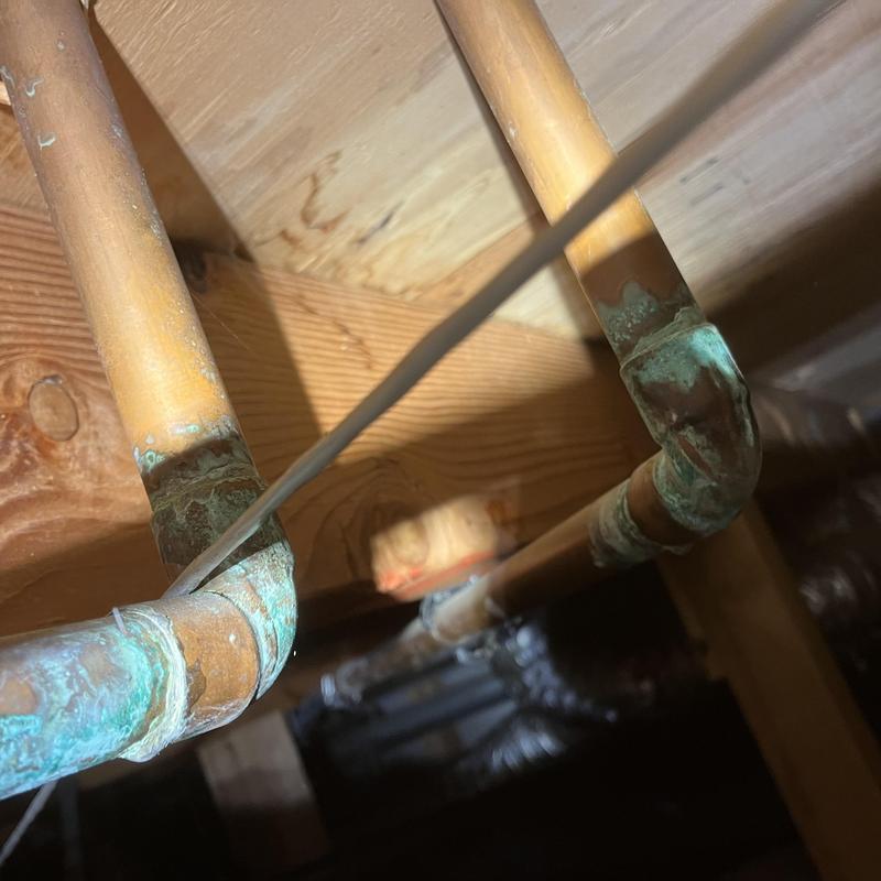 Polybutylene piping with corroded copper fittings in crawlspace