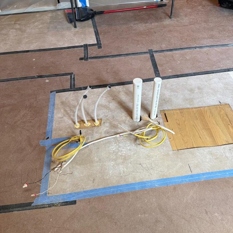 Kitchen plumbing rough-in with piping and wiring layout