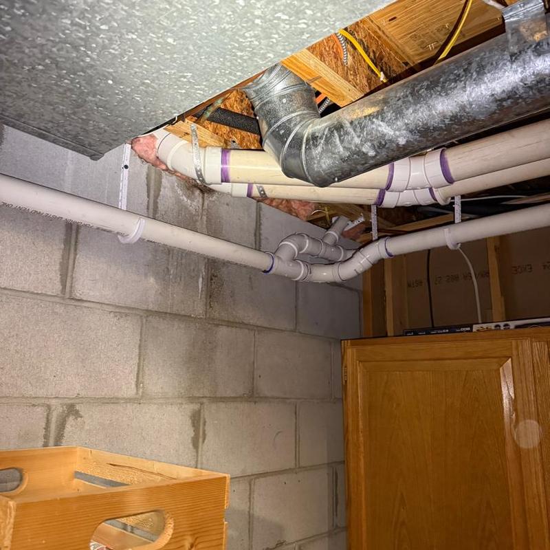 PVC plumbing pipes roughed in near ceiling joists