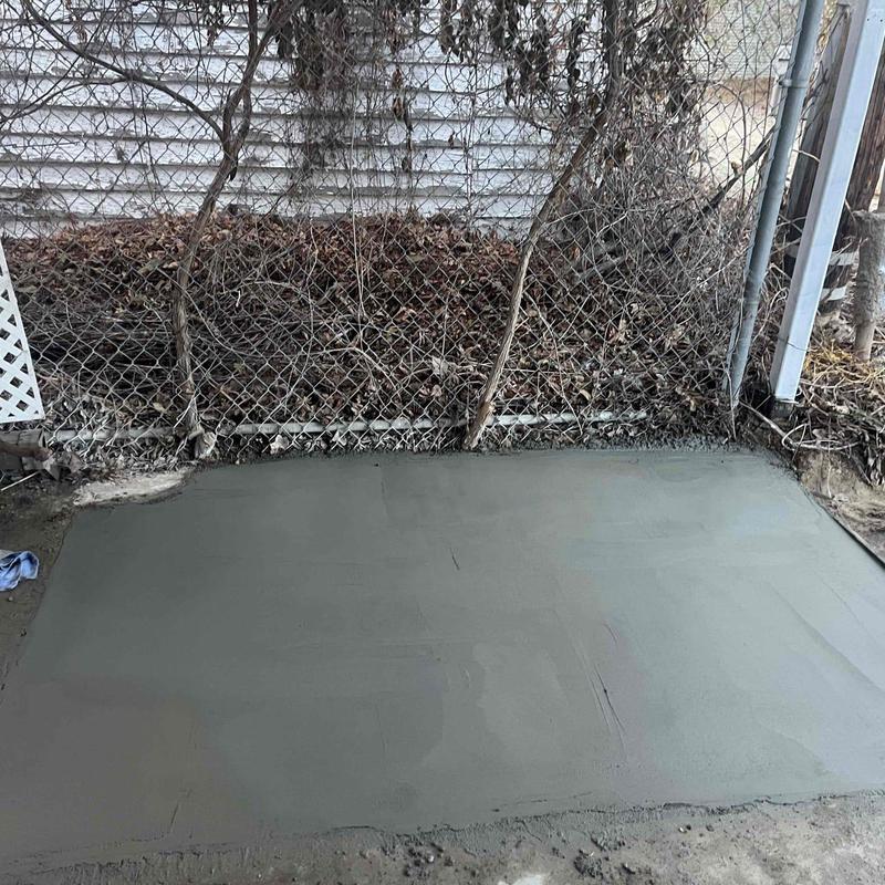 Concrete patch over sewer main excavation area