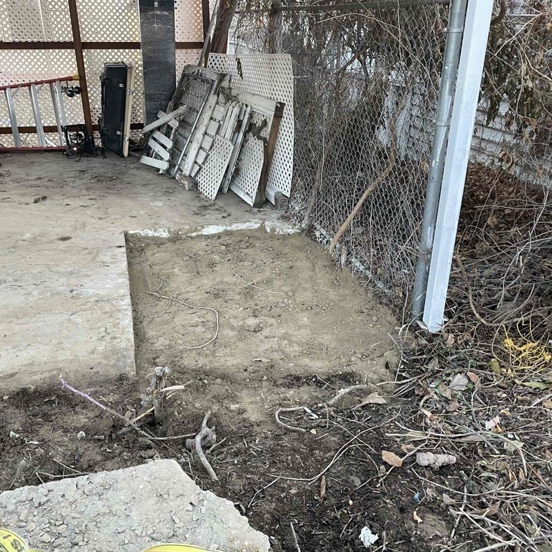 Sewer main excavation under concrete carport area