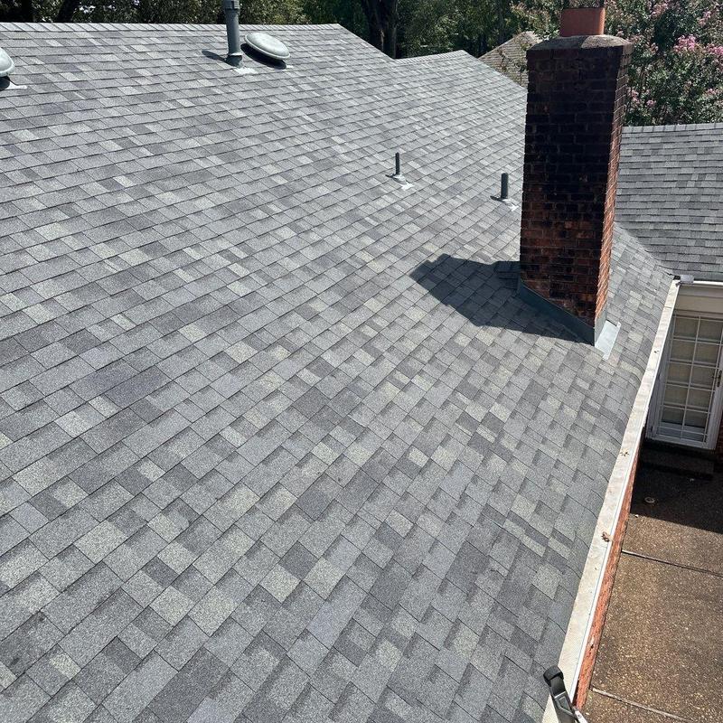 Owens Corning Oakridge asphalt roofing with chimney flashing
