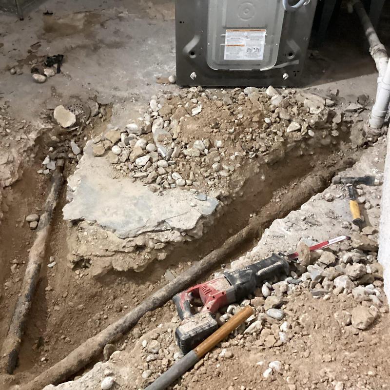 Cast iron branch line excavation and replacement in basement