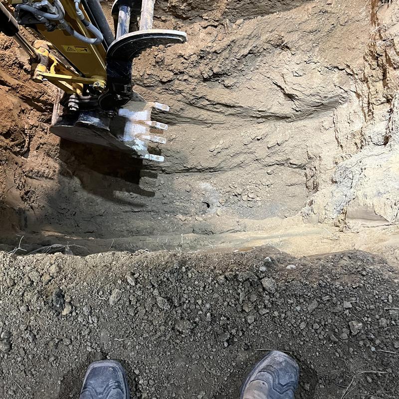 Cesspool excavation with backhoe and soil removal
