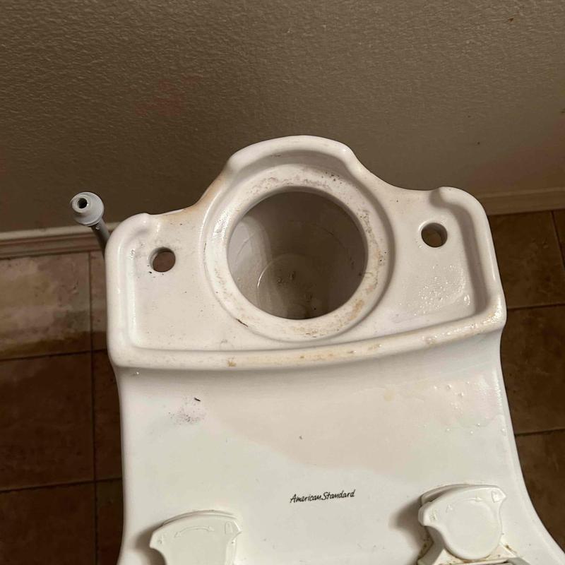 Toilet tank with gasket and mounting holes