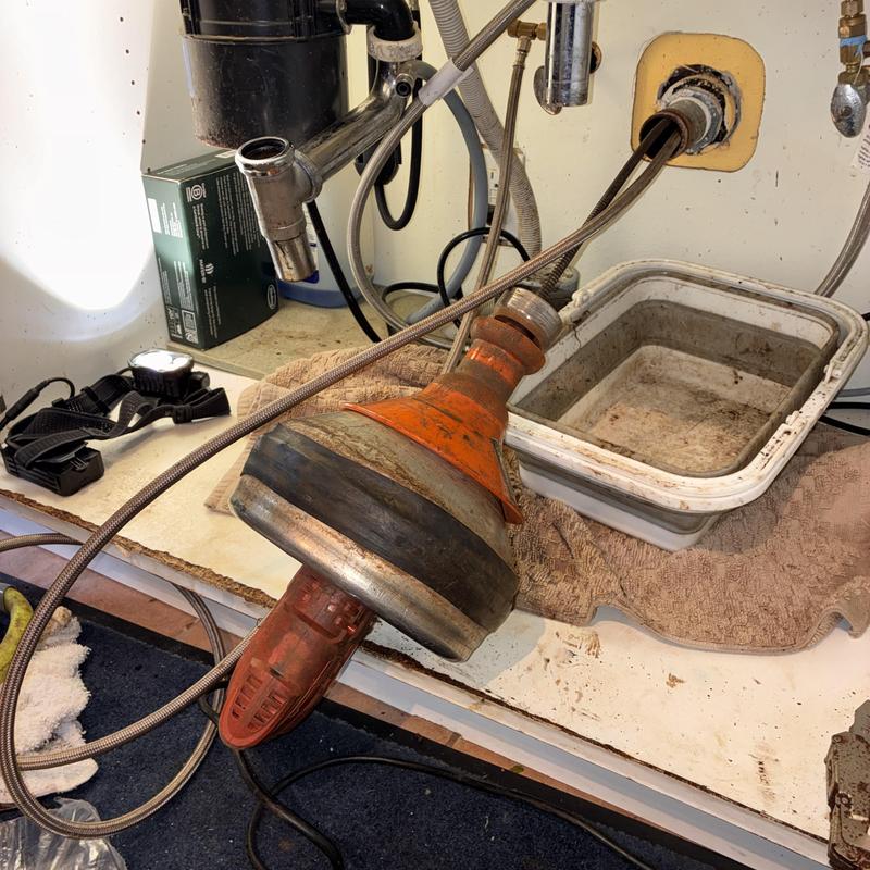 Kitchen sink drain cleaning with cable machine tool Kitchen sink drain cleaning with cable machine tool