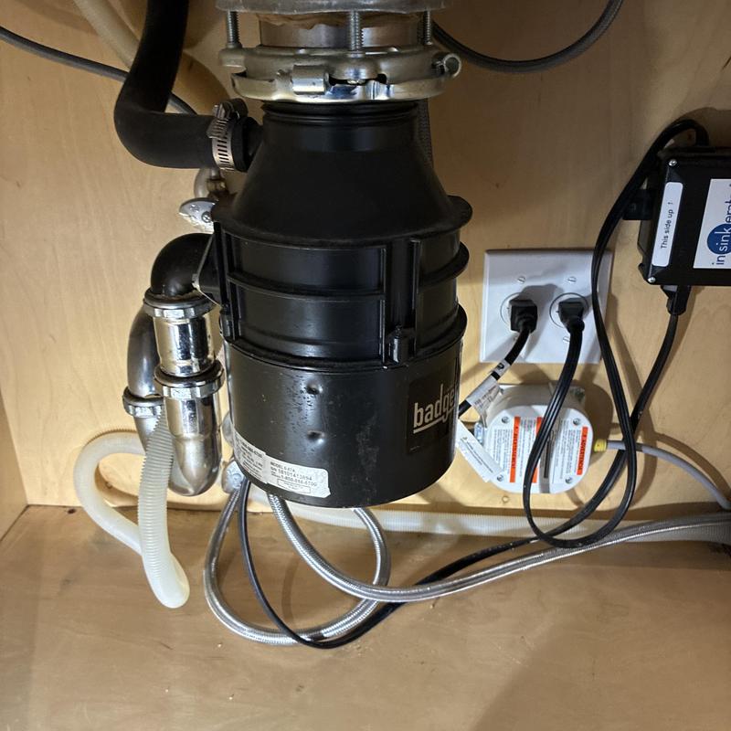 Garbage disposal and dishwasher hose under sink Garbage disposal and dishwasher hose under sink