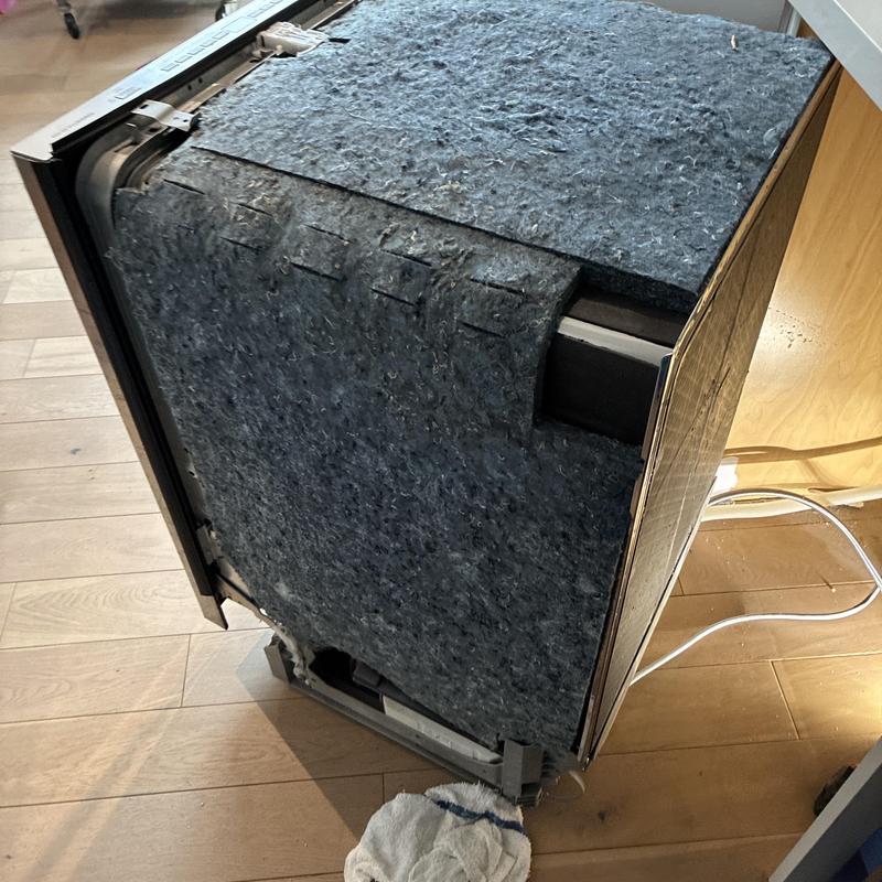 Dishwasher with removed outer panel for repair work Dishwasher with removed outer panel for repair work