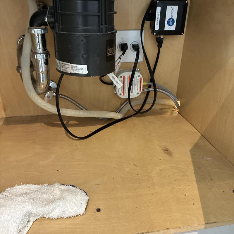 Garbage disposal and dishwasher hose under sink Garbage disposal and dishwasher hose under sink