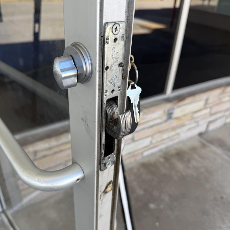 Thumb turn cylinder lock with keys on metal door Thumb turn cylinder lock with keys on metal door