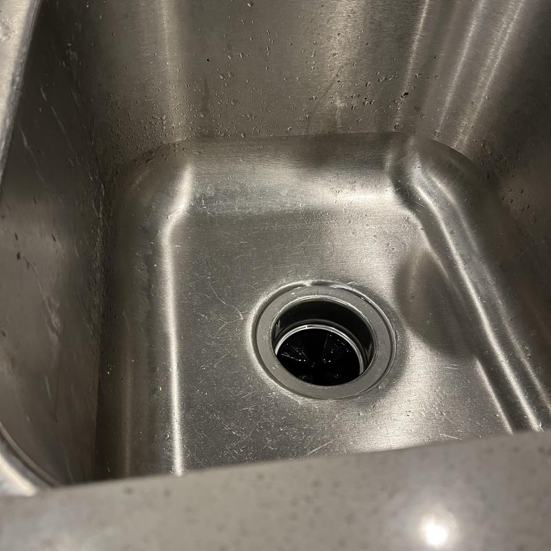 Kitchen sink drain with garbage disposal stopper