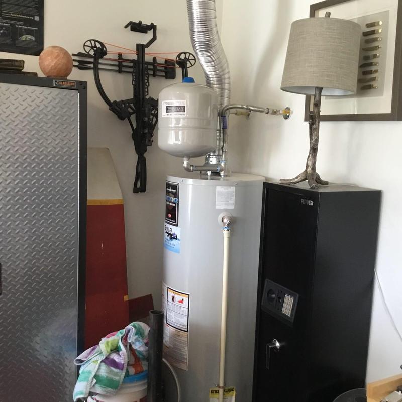 Expansion tank and water heater pressure adjustment in utility room