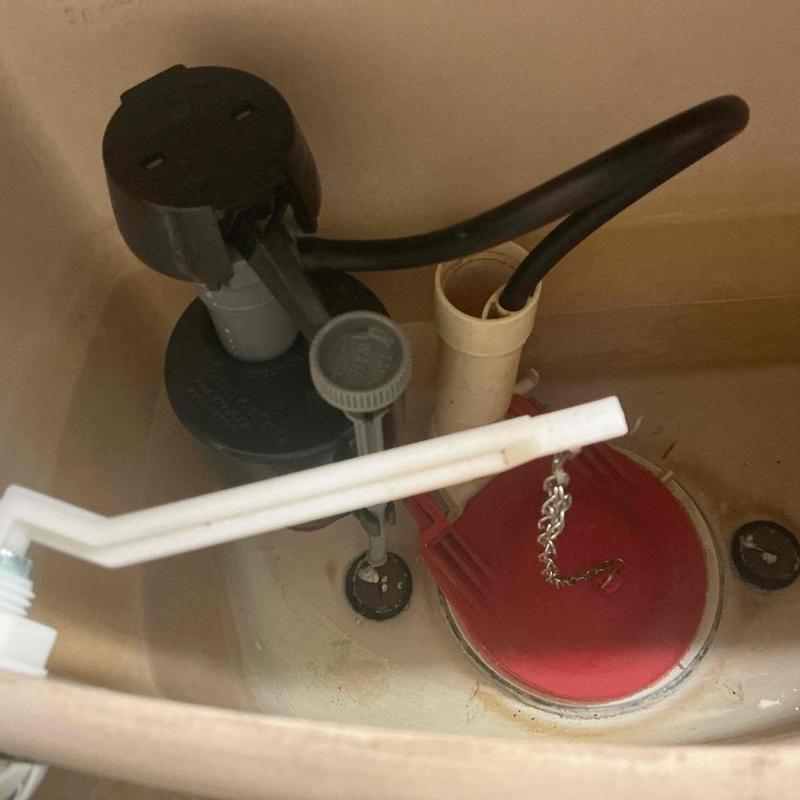 Toilet fill valve and flapper installation inside tank