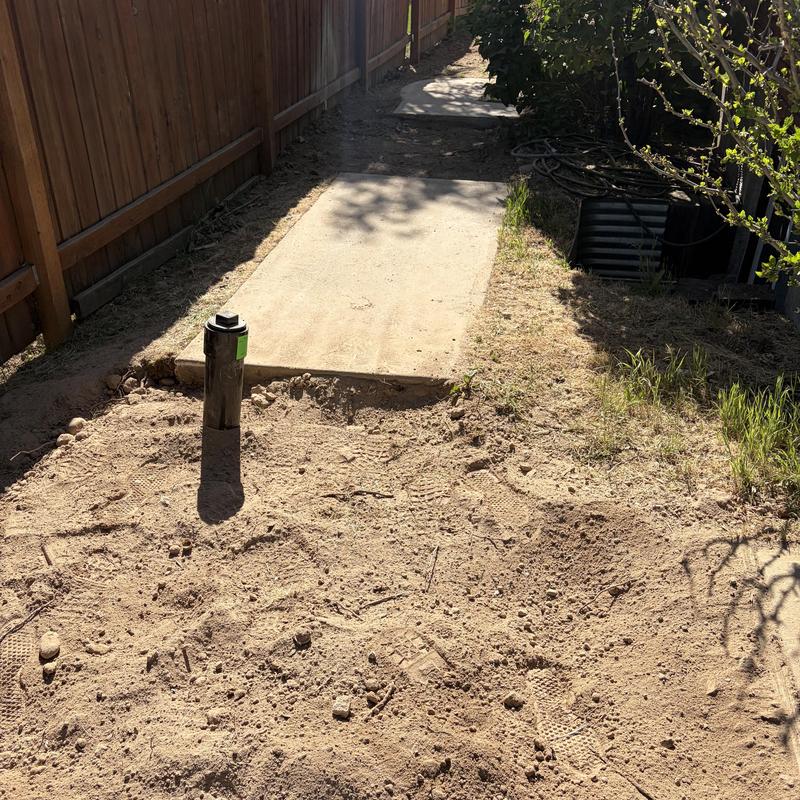 Sewer main installation with concrete access slab