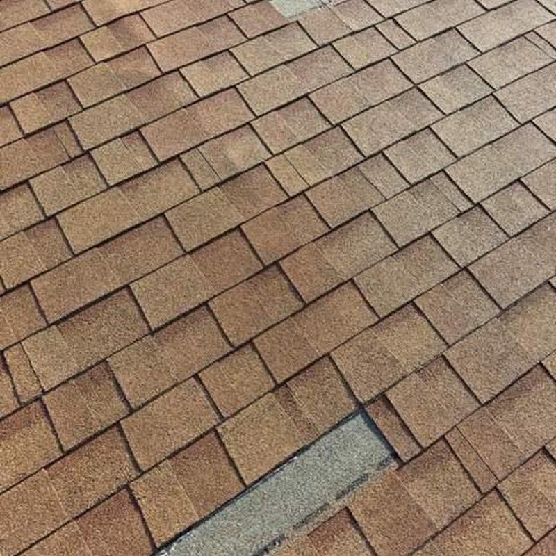 Shingle roof with missing and damaged shingles