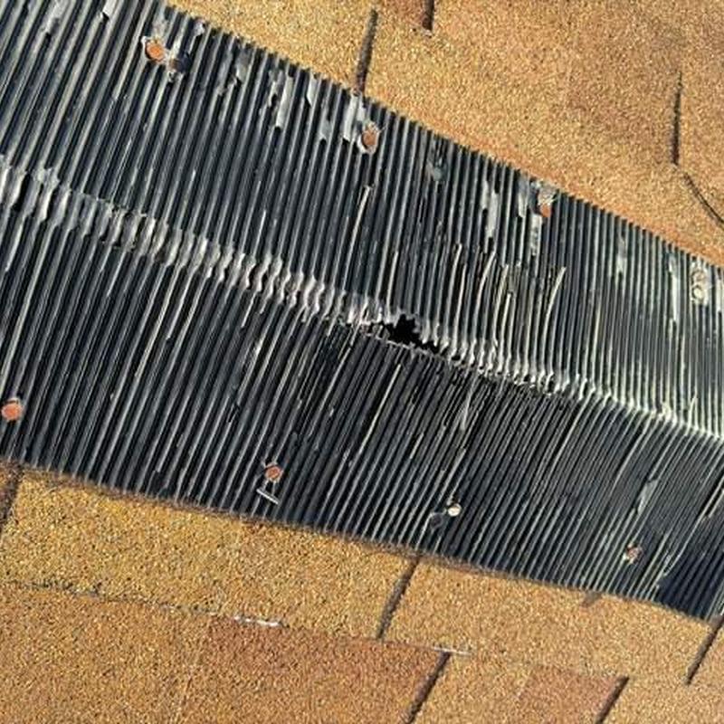 Shingle roof with damaged vent flashing and nails