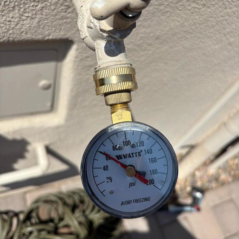 Water pressure gauge on outdoor faucet reading 80 psi