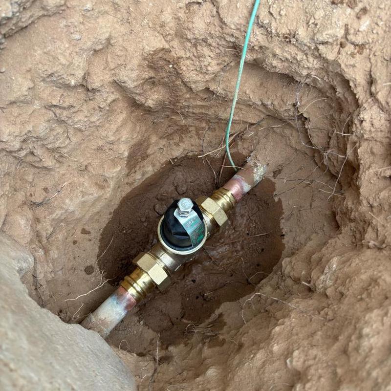 Pressure relief valve with tan access box in ground
