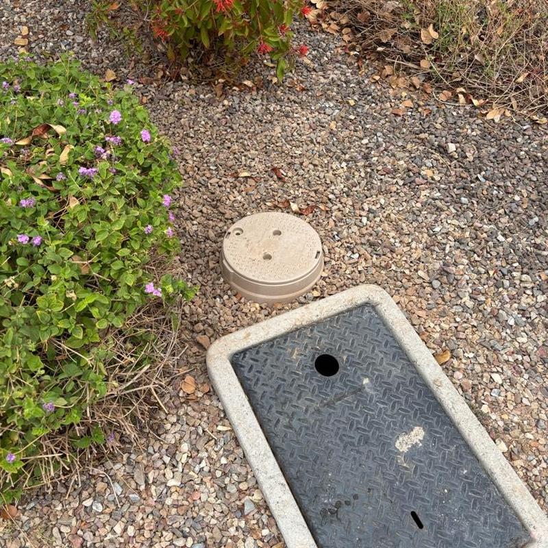 One-inch PRV with tan access box near meter